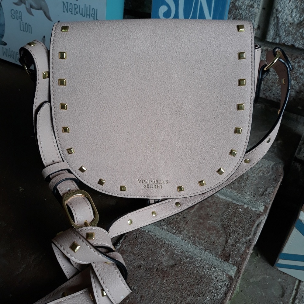A Victoria Secret small hand bag with a strap